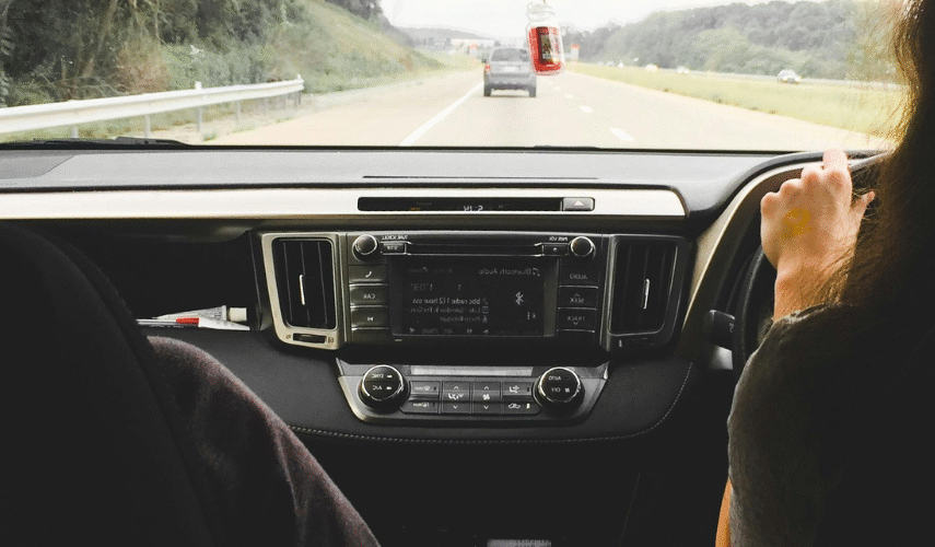 Learner driver and instructor driving in a car